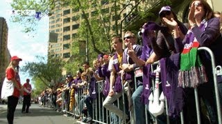 Players take in the parade