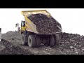 D-11 and Rock Trucks Back Filling a BIG Hole