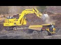 D-11 and Rock Trucks Back Filling a BIG Hole