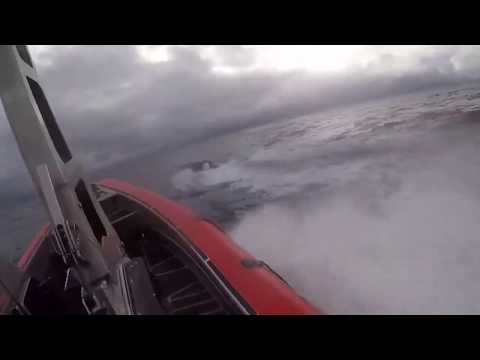 Coast guardsman jumps onto moving submarine full of drugs