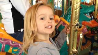 Chloe rides the carousel