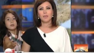 Moroccan newsreader Lena Alwash's daughter interrupts live broadcast.