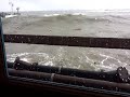 Rogue wave crashes headon through restaurant window after breakfast, 1st person view