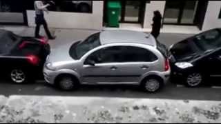 Lady doing the impossible to park her car