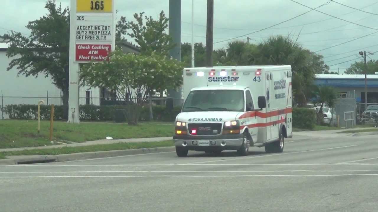 Crazy ambulance Driver Lights No Siren Runs Over Curb YouTube