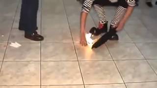 Clown burns a dove on a failed magic trick