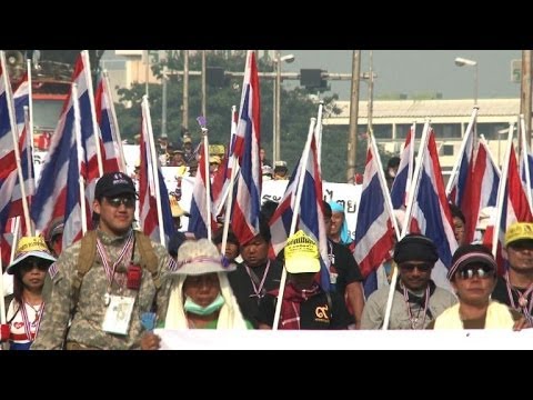 Thai anti-government protesters besiege polling stations in Bangkok forcing dozens to close as advance voting for controversial elections gets under way, deepening doubts over the viability of next weekend\'s ballot. Duration: 00:47