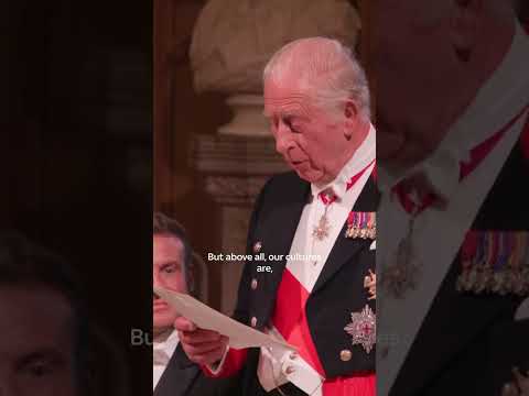King shows off French skills to Macron