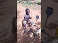 African kid plays makeshift drums. video goes viral