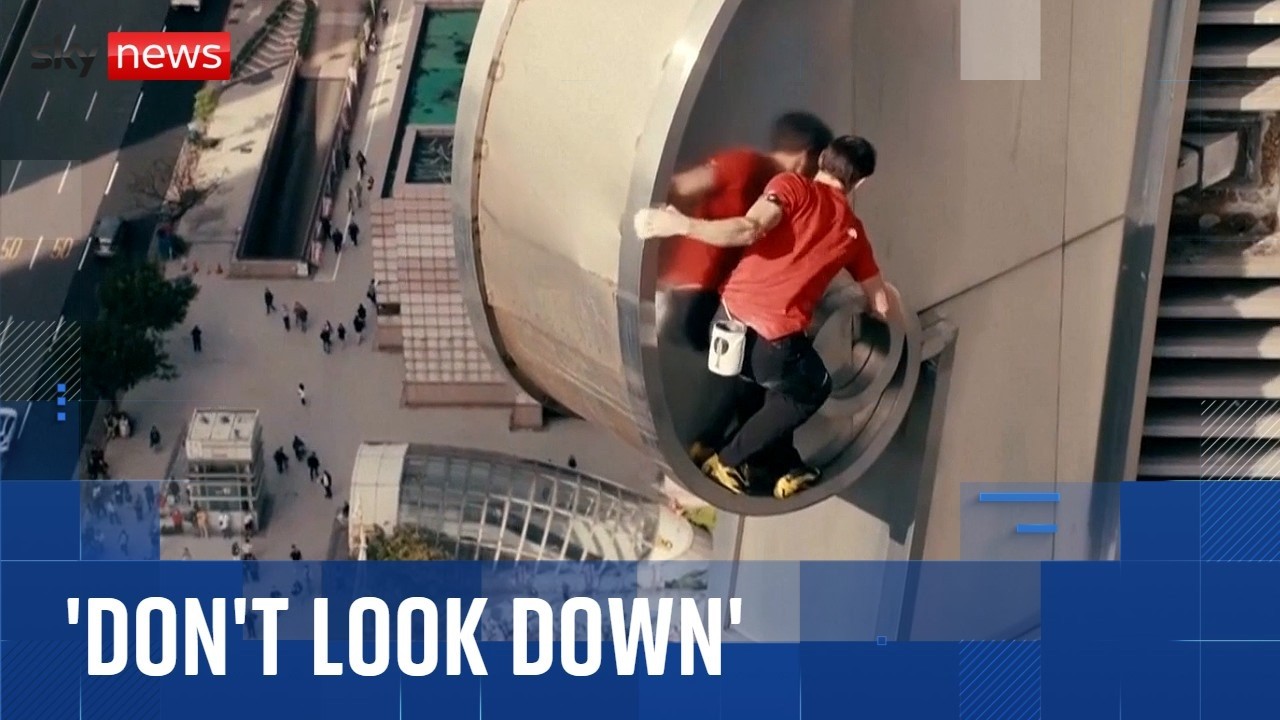 Climber Alex Honnold scales Taipei 101 skyscraper without ropes