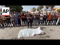 Palestinians at Al Aqsa hospital mourn victims of airstrikes in central Gaza