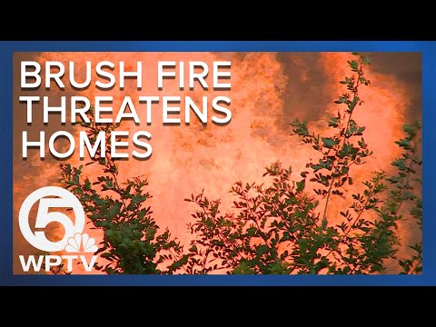 Brush fire breaks out near Stuart West community endangering homes