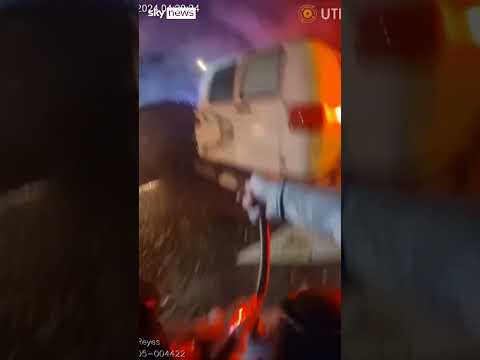 Officer rescues people from burning car