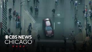 Woman charged with driving through crowd of protesters in downtown Chicago