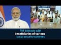 PM interacts with social security schemes beneficiaries - LIVE