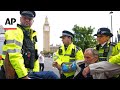 Activists rally in support of group designated as terrorist by UK government