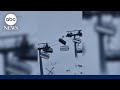 Moment powerful winds violently shake a ski lift in Italy