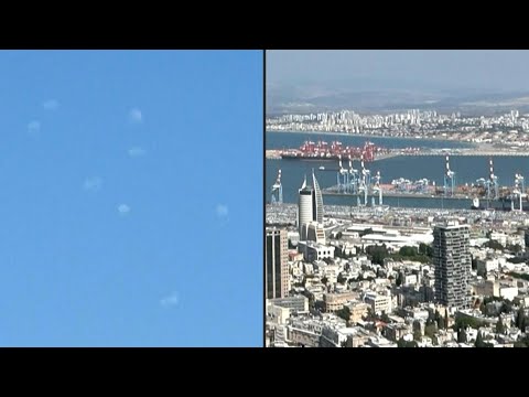 Clouds of smoke as rockets intercepted over Haifa bay | AFP