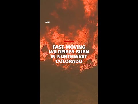 Fast-moving wildfires burn in northwest Colorado