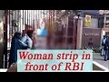 Woman takes off clothes  Infront of RBI Gate in New Delhi