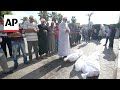 Funeral prayers outside Gaza hospital for three dead, including two children, after Israeli strike