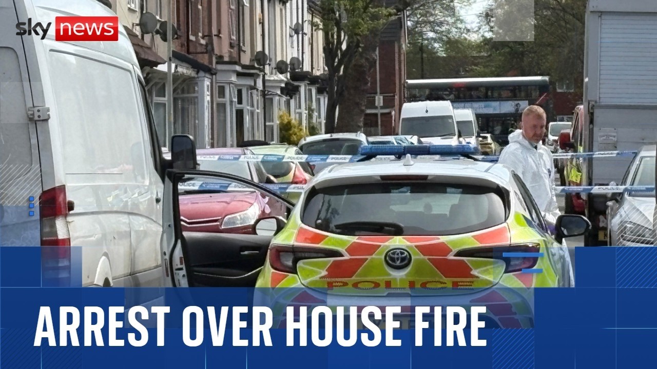 Woman held after two young children die in house fire
