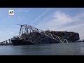 View of cargo ship and collapsed Baltimore bridge from Coast Guard boat as recovery effort continues  - 01:01 min - News - Video