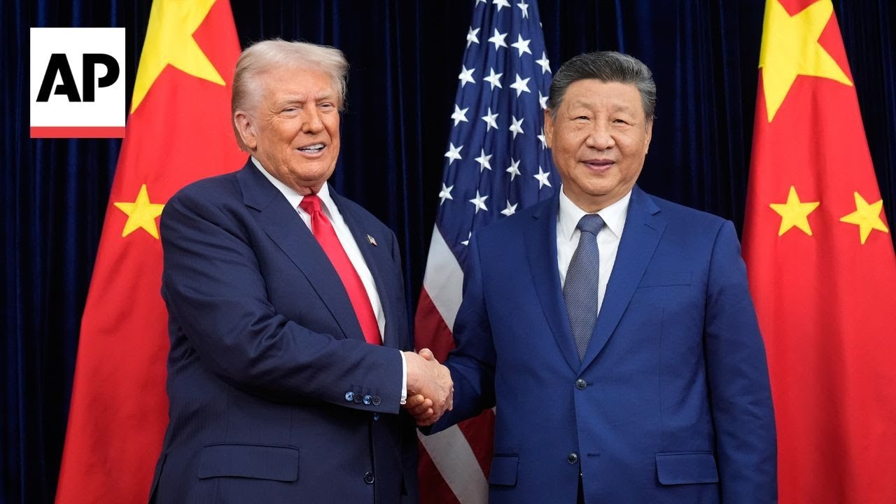 Trump and Xi Jinping shake hands at meeting in South Korea