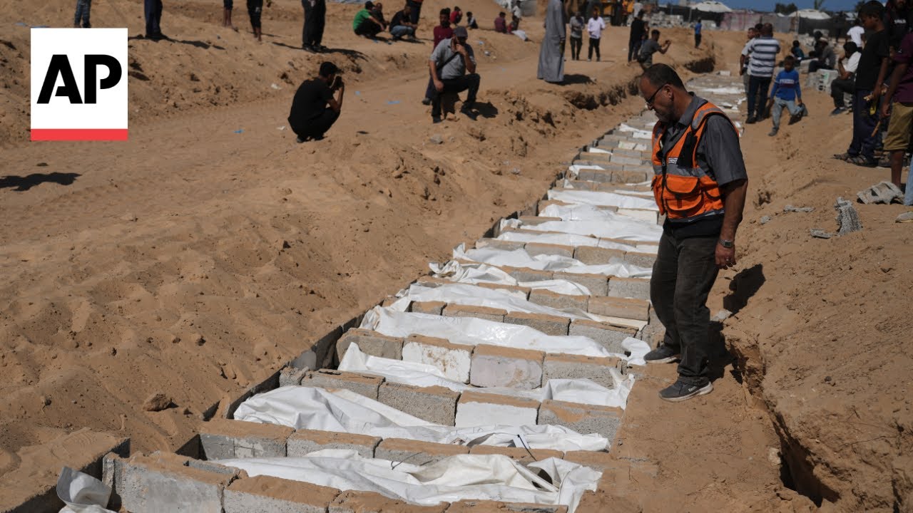 Prayers for the dead as bodies of 54 Palestinians buried in Gaza after return by Israel