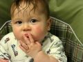 Baby Matthew eats finger food