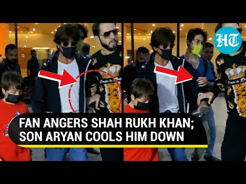 SRK loses cool after fan tries to grab his hand for selfie; Watch Aryan Khan's reaction SRK loses cool after fan tries to grab his hand for selfie; Watch Aryan Khan's reaction