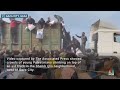 Video shows aid trucks surrounded by crowds near Gaza City  - 00:48 min - News - Video