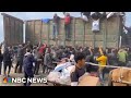 Video shows aid trucks surrounded by crowds near Gaza City