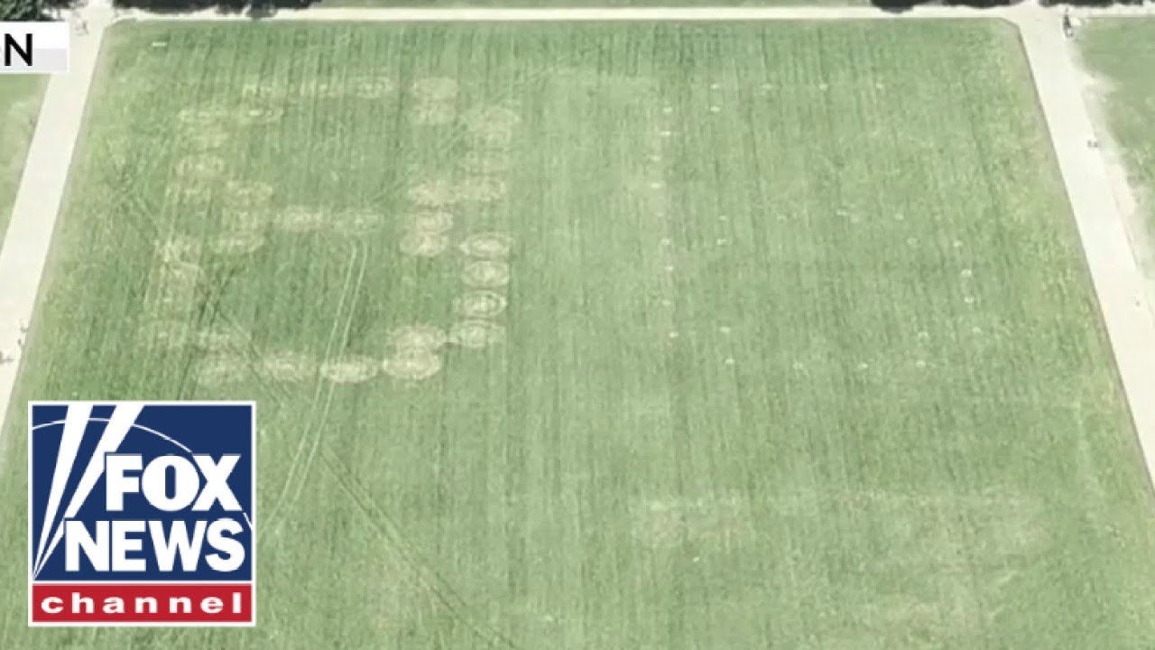 '86 47' VANDALIZED on grass at National Mall