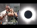 Watch emotional moments as skywatchers view solar eclipse