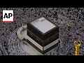 Pilgrims entering Mecca for Hajj take steps to protect themselves from heat - AP explains