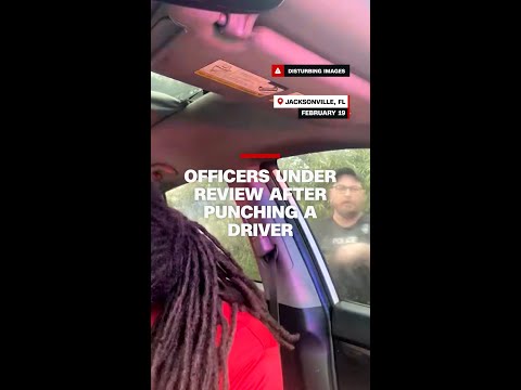 Officers under review after punching a driver