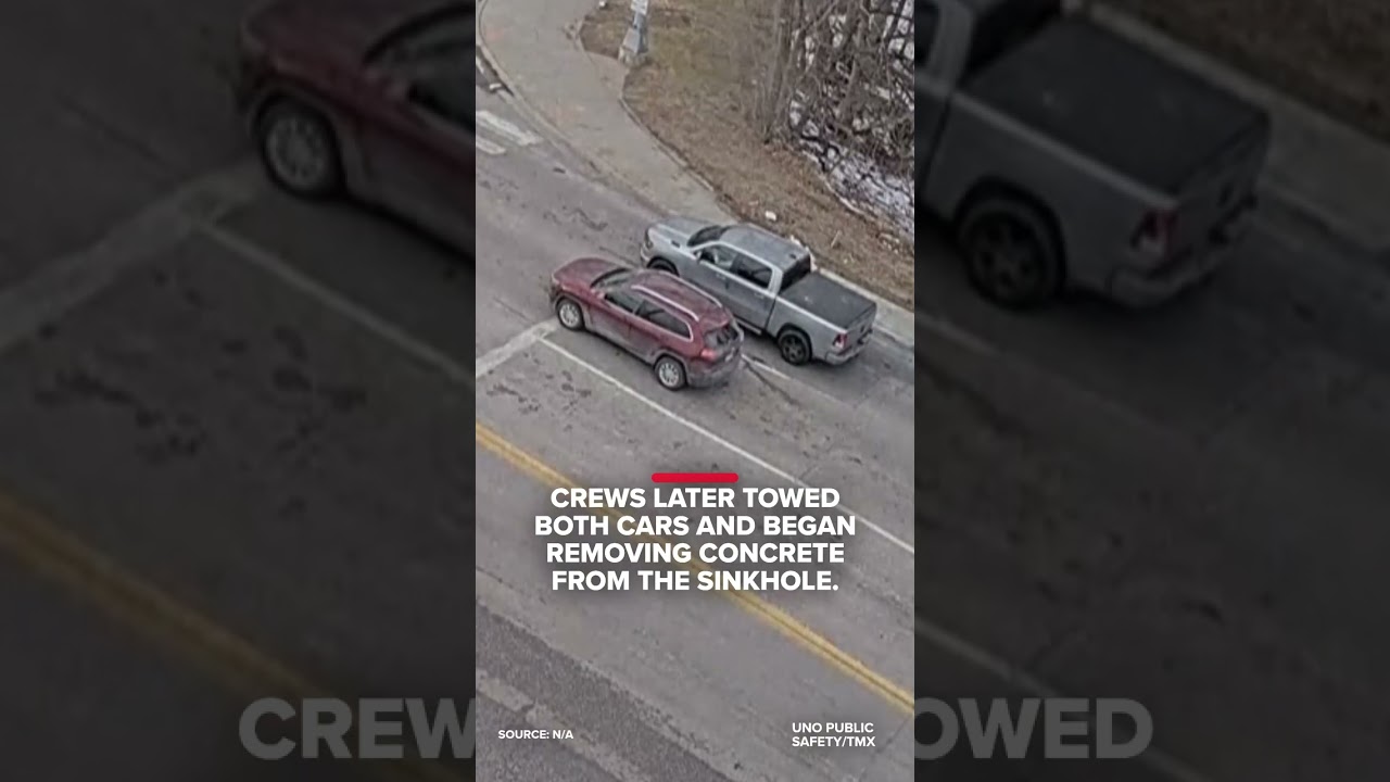 Caught on camera: SINKHOLE SWALLOWS 2 cars at Omaha red light