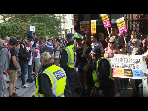 Pro- and anti-migrant protesters gather outside London hotel thought to house asylum seekers | AFP