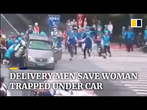 Delivery men in China lift car to save woman trapped underneath