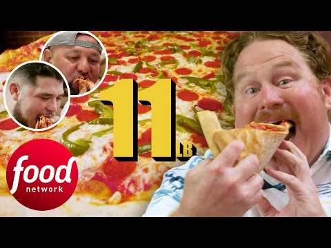 Casy And Two Locals Struggle To Finish This 11 Lb Pizza In Less Than 45 Minutes | Man V Food