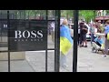 Hugo Boss cuts sales outlook again as China flags | REUTERS - 01:11 min - News - Video