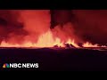 Aerial footage shows Iceland volcano spewing lava