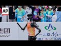 Humanoid robots run a half-marathon in China alongside humans