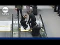 Pilot sues after foot gets stuck in moving walkway at Denver Airport