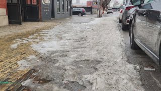 Snow mountains melt around downtown Louisville as temperatures rise