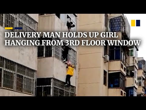 Delivery man climbs onto third floor to hold four-year-old girl hanging from window Delivery man climbs onto third floor to hold four-year-old girl hanging from window