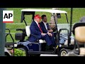 Eric Trump drives his dad around on a golf cart in his Florida resort