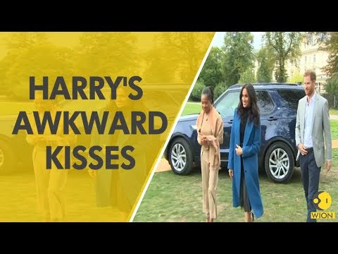 Watch Prince Harry akwardly 'air kiss' a Muslim woman