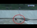 People make chain to rescue a dog from carried away in reservoir- Visuals